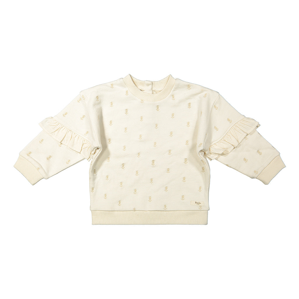 Spring Sweater van Bajé Studio. Zandkleurige sweater van zacht biologisch katoen met geborduurde bloemen, linnen ruffles op de mouwen en een relaxed fit 